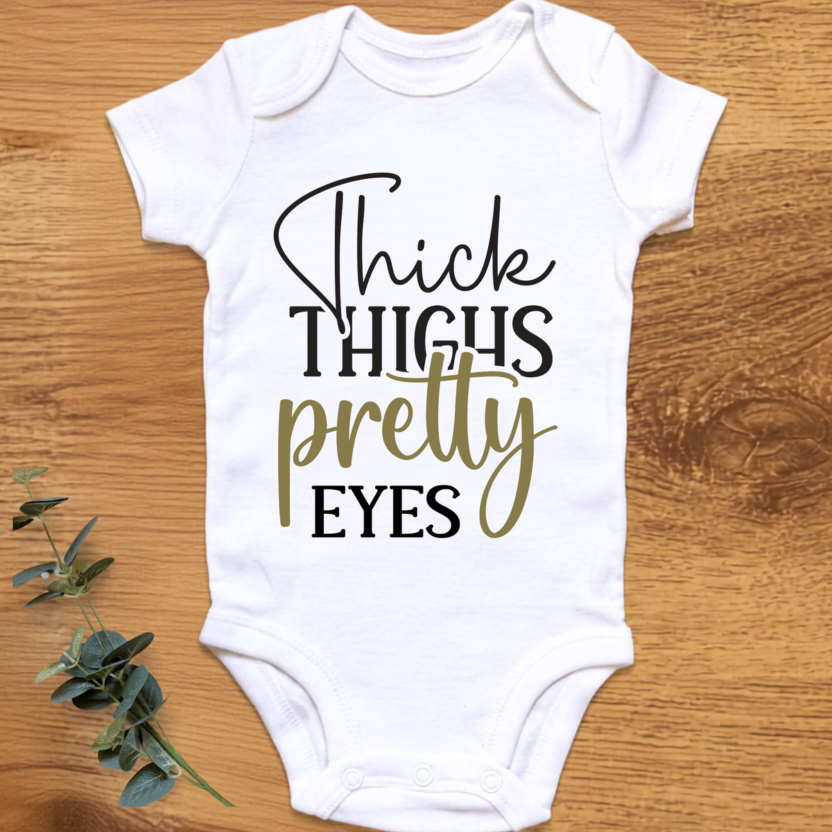 Thick Thighs Pretty Eyes baby onesie by By Delilah