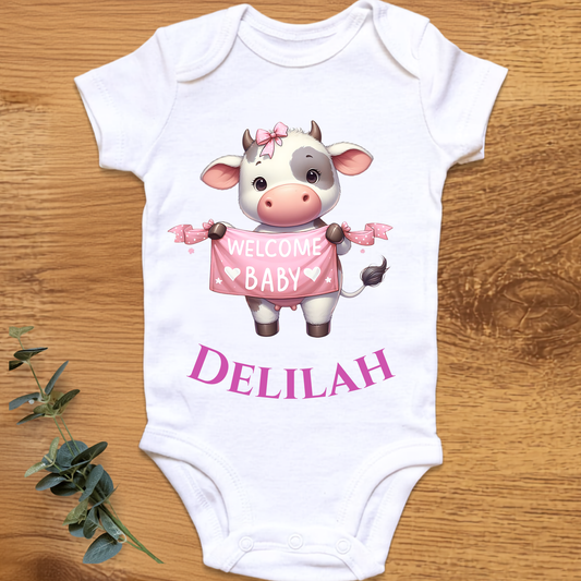 Welcome baby girl onesie with cow, personalised by By Delilah