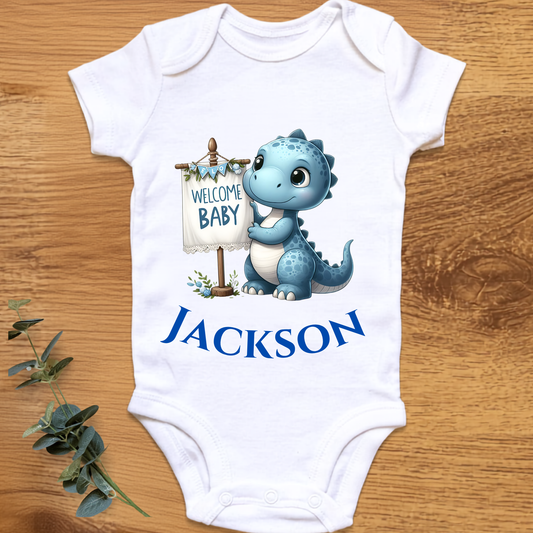 Welcome baby boy onesie with dinosaur, personalised by By Delilah